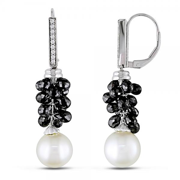 total of sixteen pave set white diamonds and 30 wire set black diamonds dazzle in a bail of 14k white gold with hanging round white South Sea cultured pearls.With an approximate total weight of 12.14 carats these black and white diamond drop earrings add a level of mystery and style to each white South Sea pearl measuring 9-10mm.