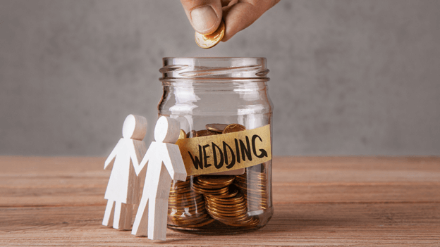 a glass jar labeled with the word wedding