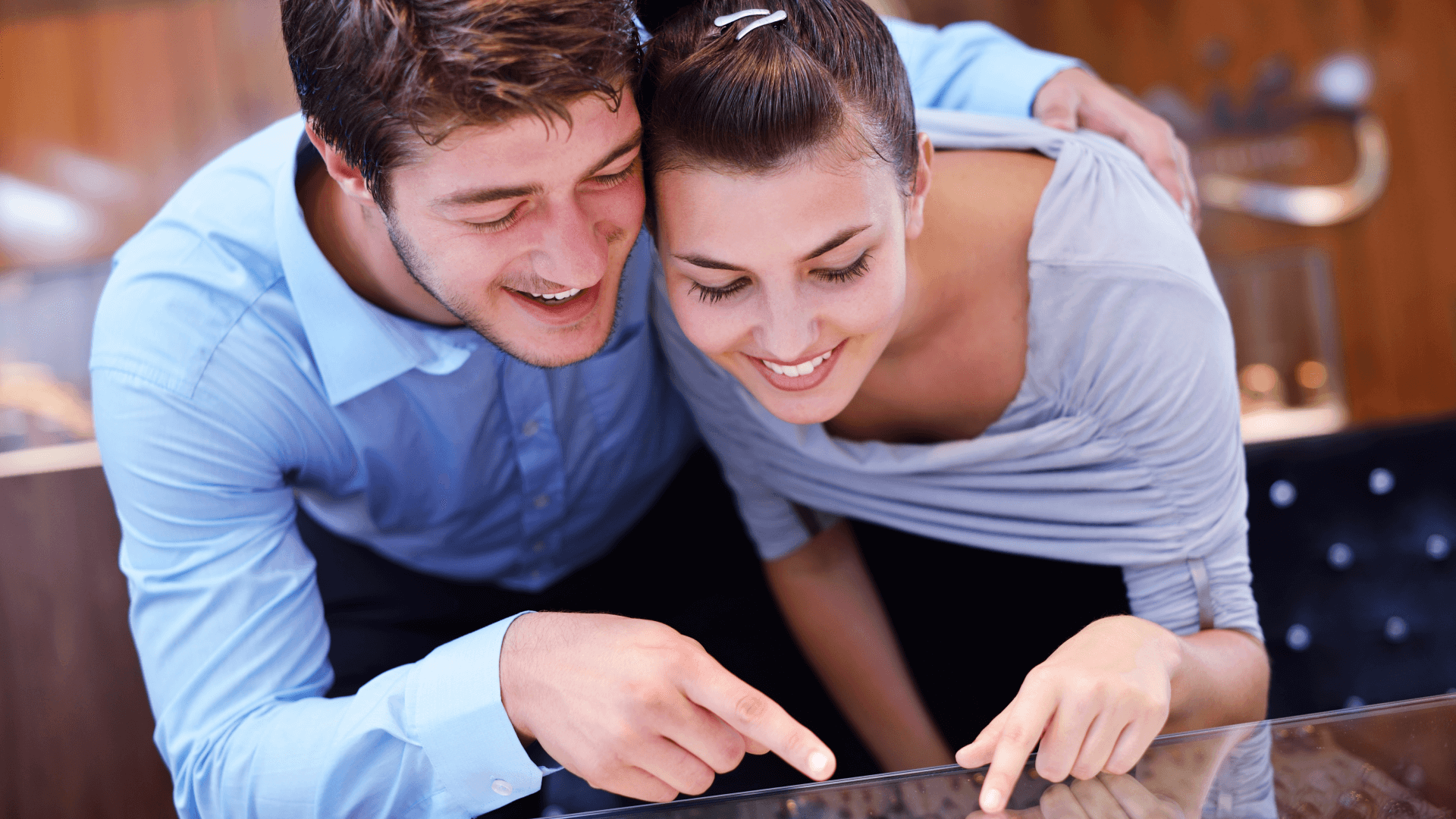 a couple buys engagement rings in a jewelry store