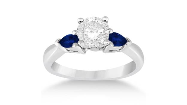 a pear three stone blue sapphire