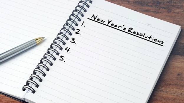 a blank list of New Year's Resolutions on a notepad