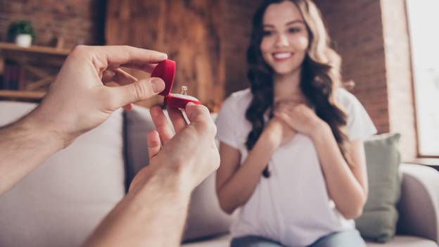 a marriage proposal in a living room