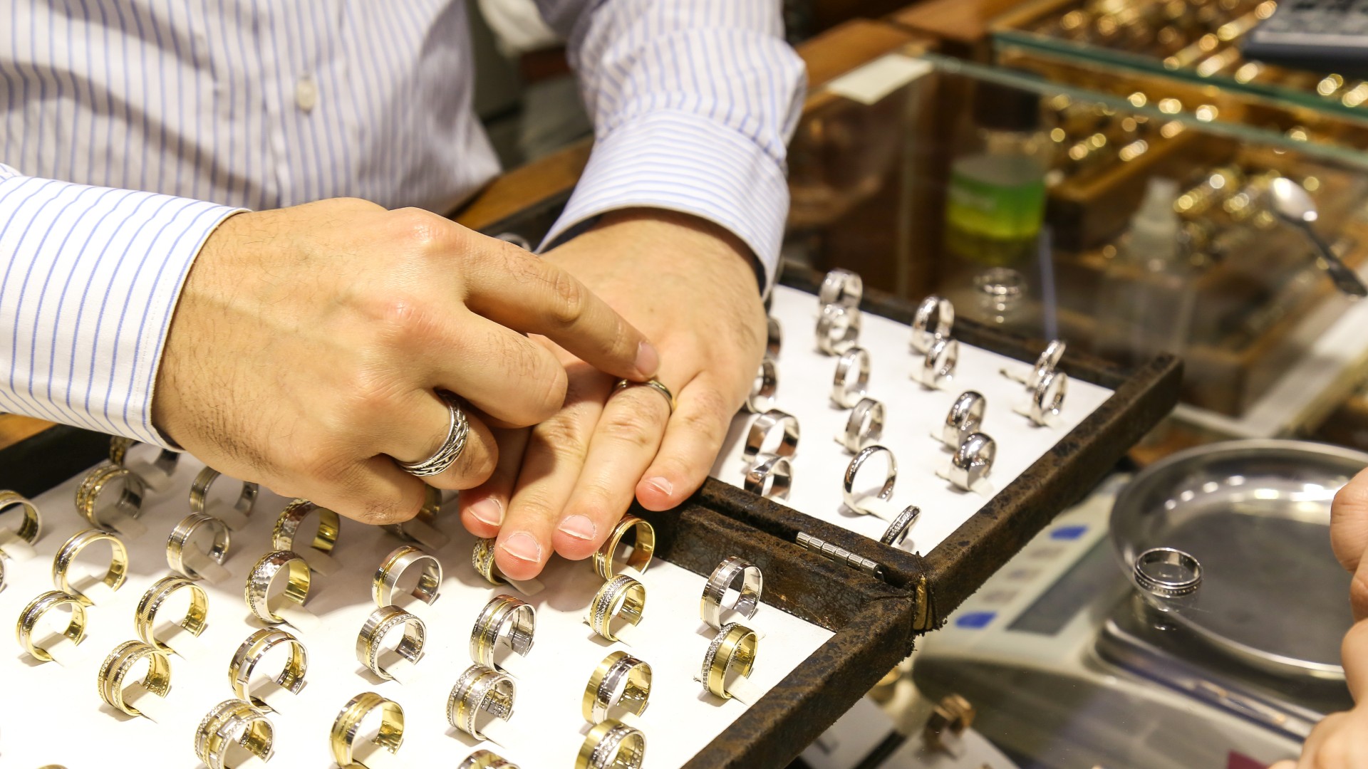 Valentine’s Day Gift Guide: a person’s hands holding a heart-shaped box