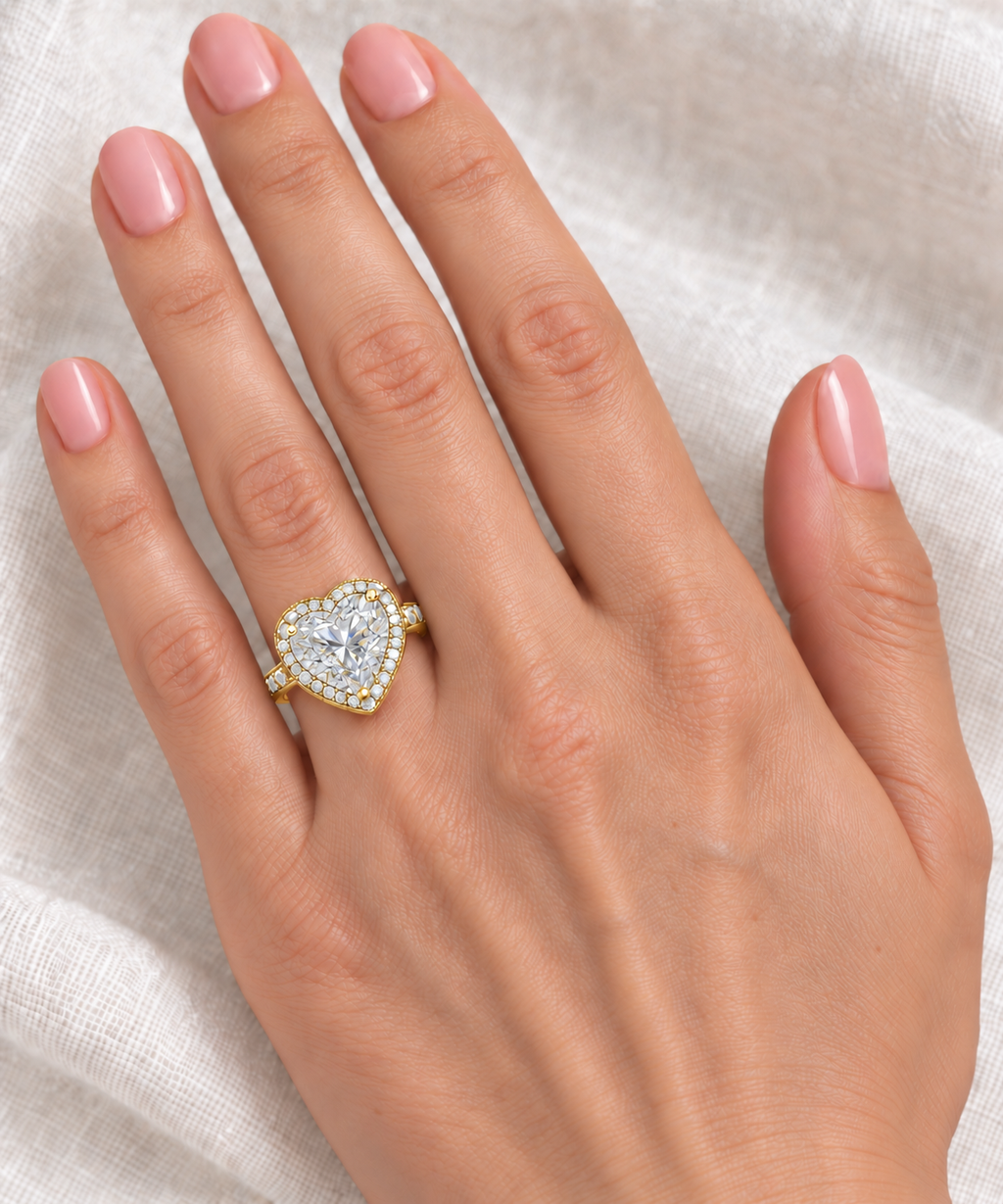 12 × 12 mm heart-shaped lab diamond halo ring in 14K yellow gold — on-hand view