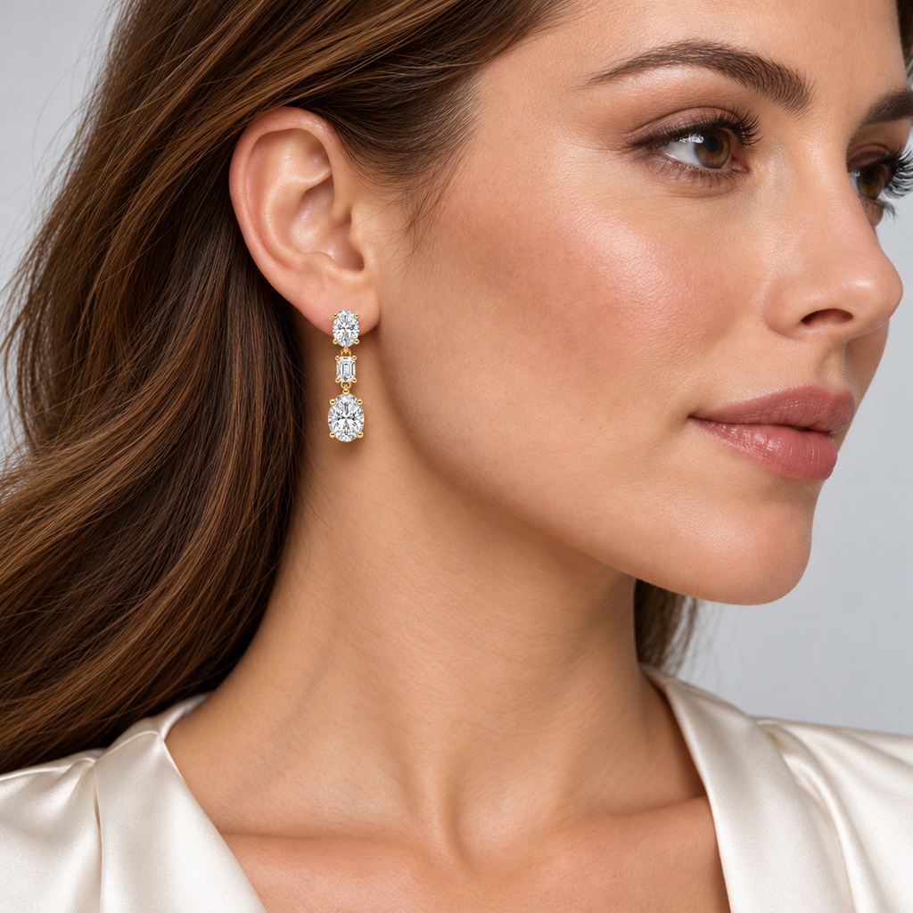 Oval & Emerald Cut Lab Grown Diamond Drop Earrings 14k Yellow Gold (7.80ctw) — first model view, four-prong setting, 1.20 inches long by 0.33 inches wide