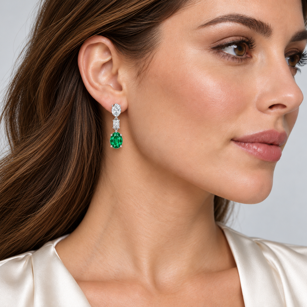 Oval Lab Grown Emerald & Diamond Drop Earrings 14k White Gold (6.70ctw) — first model view, four-prong setting, 1.20 inches long by 0.33 inches wide