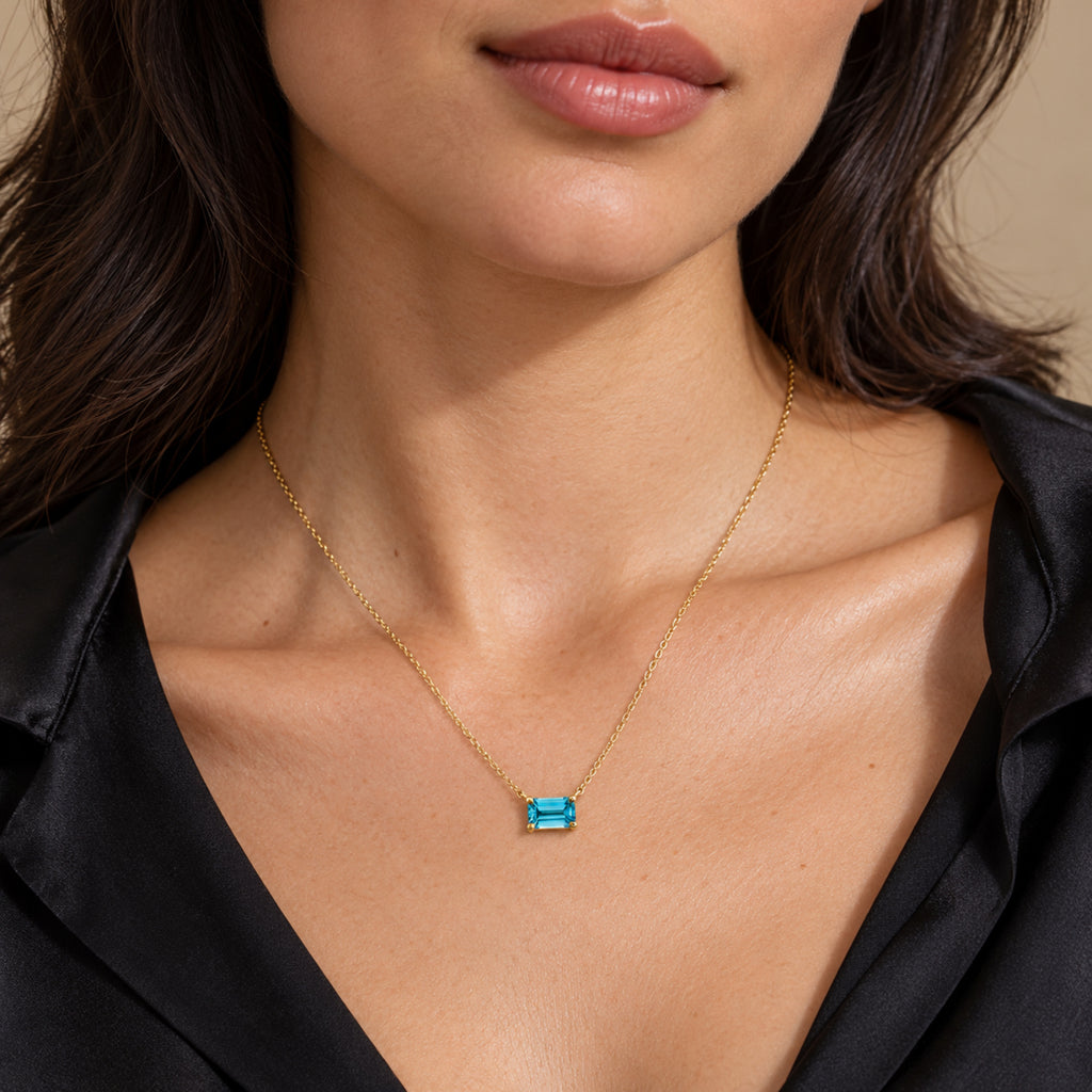 AZ29528 natural blue zircon solitaire necklace in 14K yellow gold - close-up model view