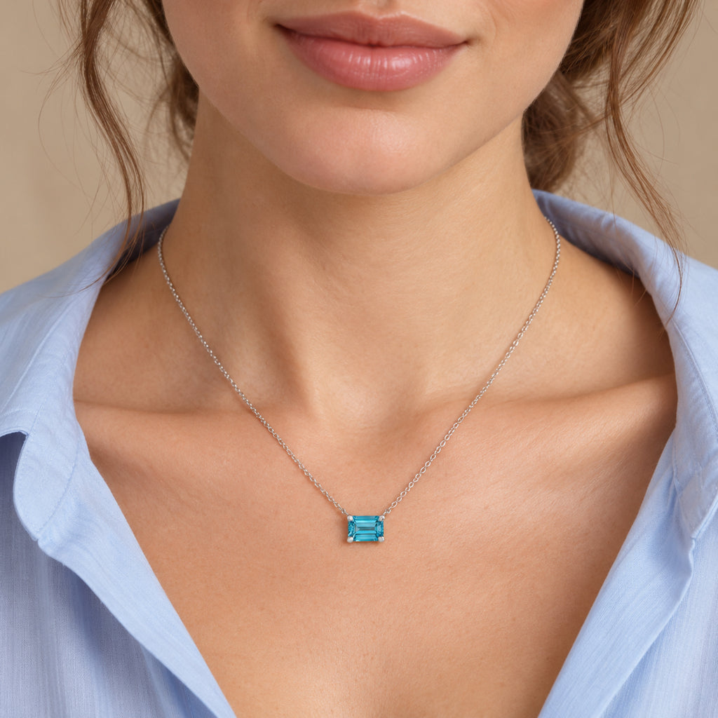 AZ29529 natural blue zircon solitaire necklace in sterling silver - close-up model view