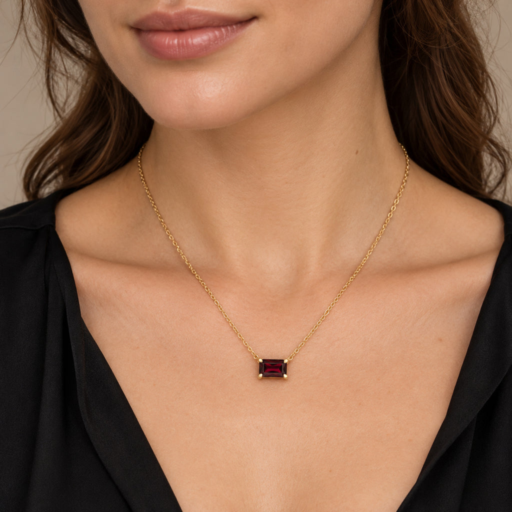 AZ29534 natural Mozambique garnet solitaire necklace in 14K yellow gold - close-up model view