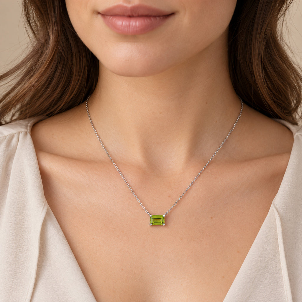 AZ29538 natural peridot solitaire necklace in sterling silver - close-up model view