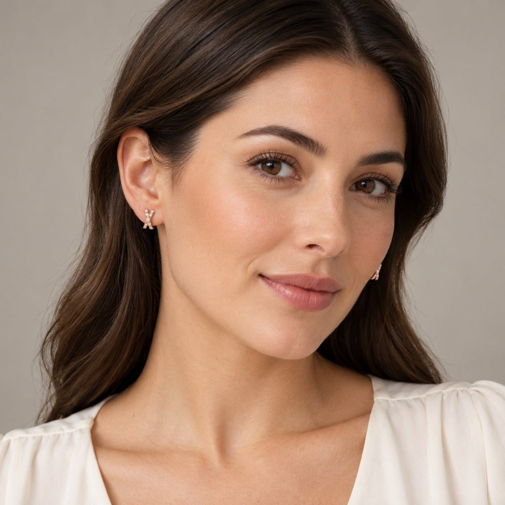 AZ29553LG — full-face model wearing 9.7 mm crossover lab-grown diamond mini huggie earrings in 14K Rose Gold; illustrative scale.