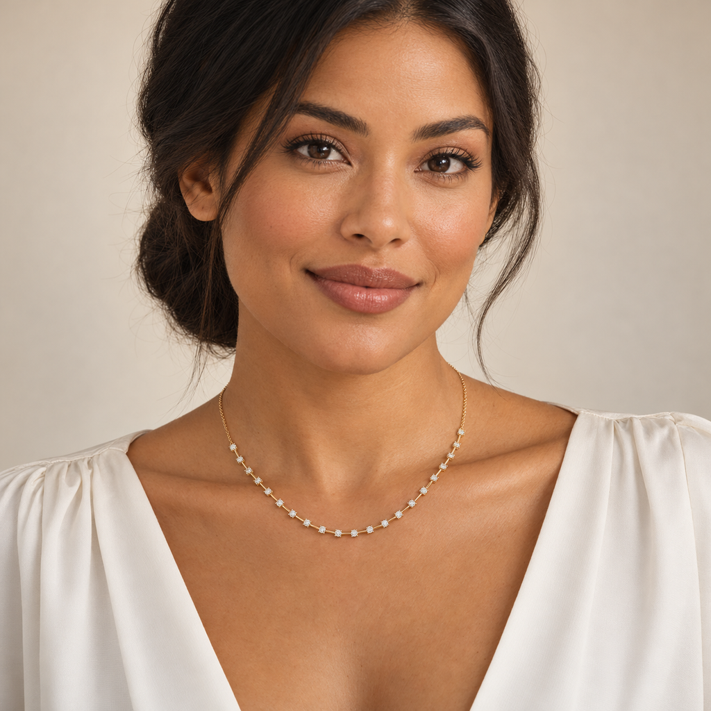 Interval diamond tennis necklace in 14K yellow gold on a new model, full-face portrait; illustrative scale.; reference design; reference design