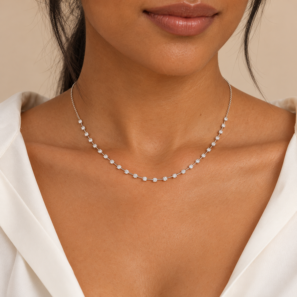 Interval diamond tennis necklace in 14K white gold on a new model, close-up; illustrative scale.; reference design; reference design