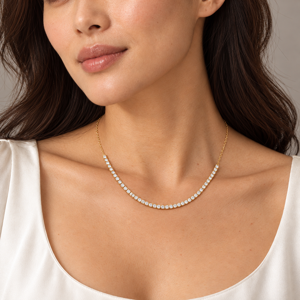 Half tennis necklace in 14K yellow gold on model — close-up; illustrative scale