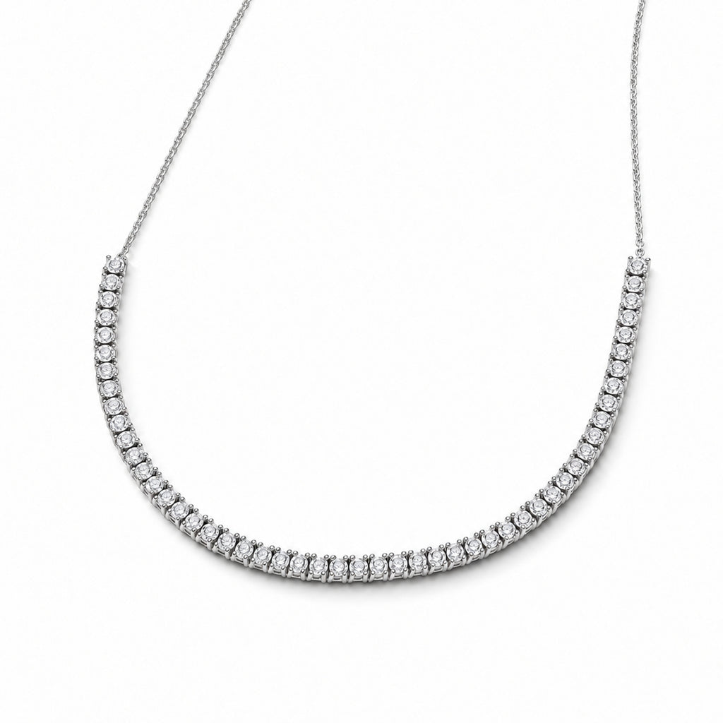 Half tennis diamond necklace in 14K white gold — angled view on white background with soft shadow