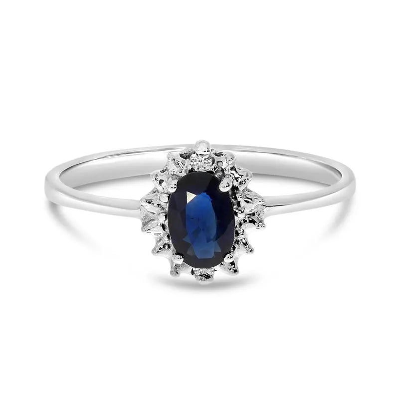 Blue sapphire and diamond halo ring in 14k white gold, true upright side view