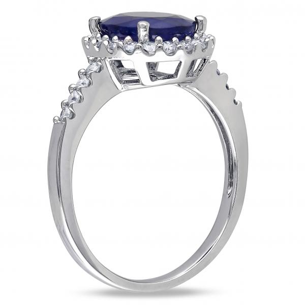 Side profile of oval blue sapphire and diamond halo engagement ring in 14k white gold, 3.92ct