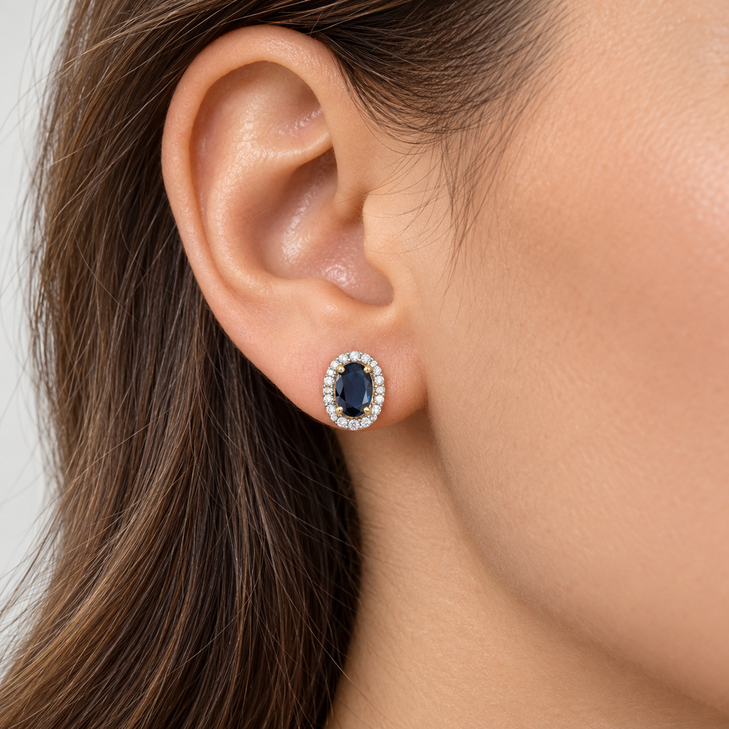 Oval Lab Blue Sapphire & Lab Diamond Halo Stud Earrings 14K Yellow Gold 1.22ct, close-up model view