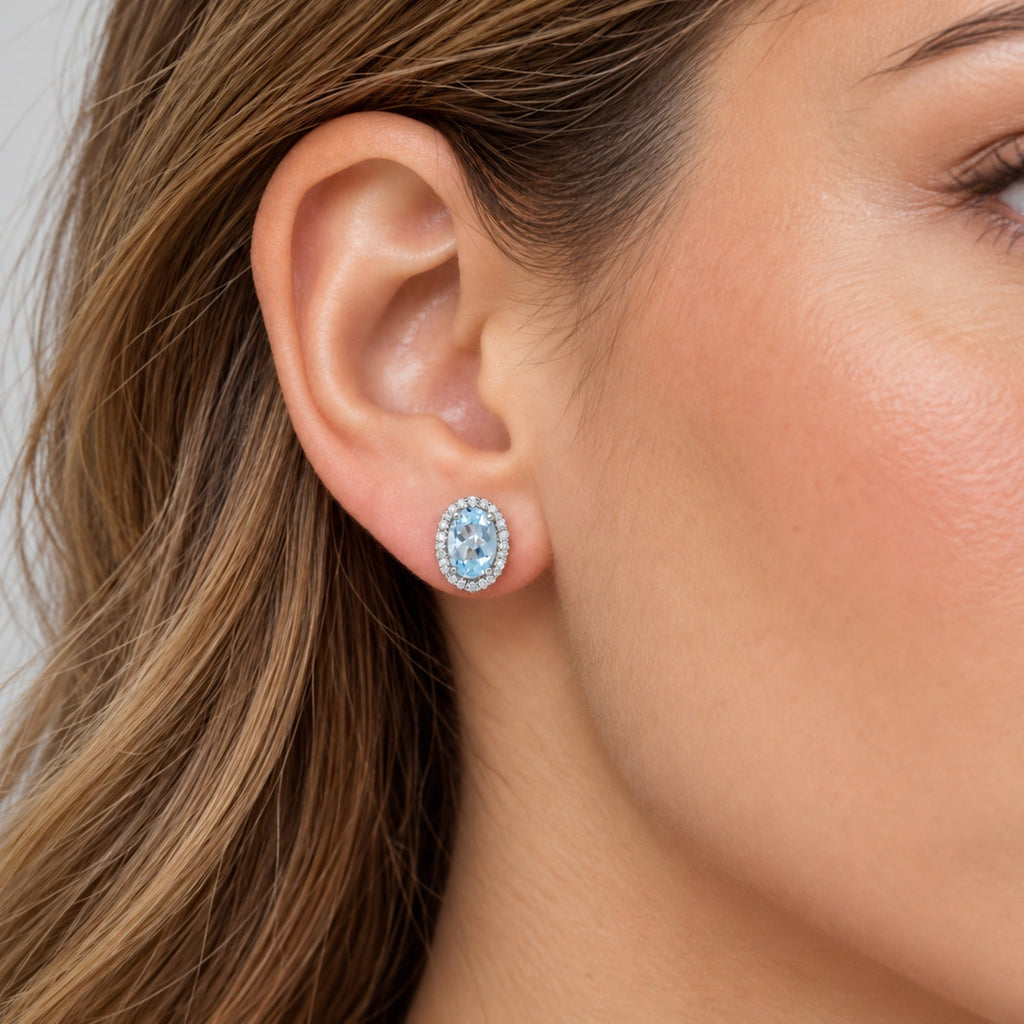 Oval Lab Aquamarine & Lab Diamond Halo Stud Earrings 14K White Gold 0.82ct, close-up model view