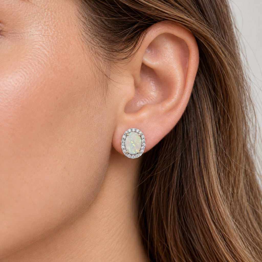 Oval Lab Opal & Lab Diamond Halo Stud Earrings 14K White Gold 1.12ct, close-up model view