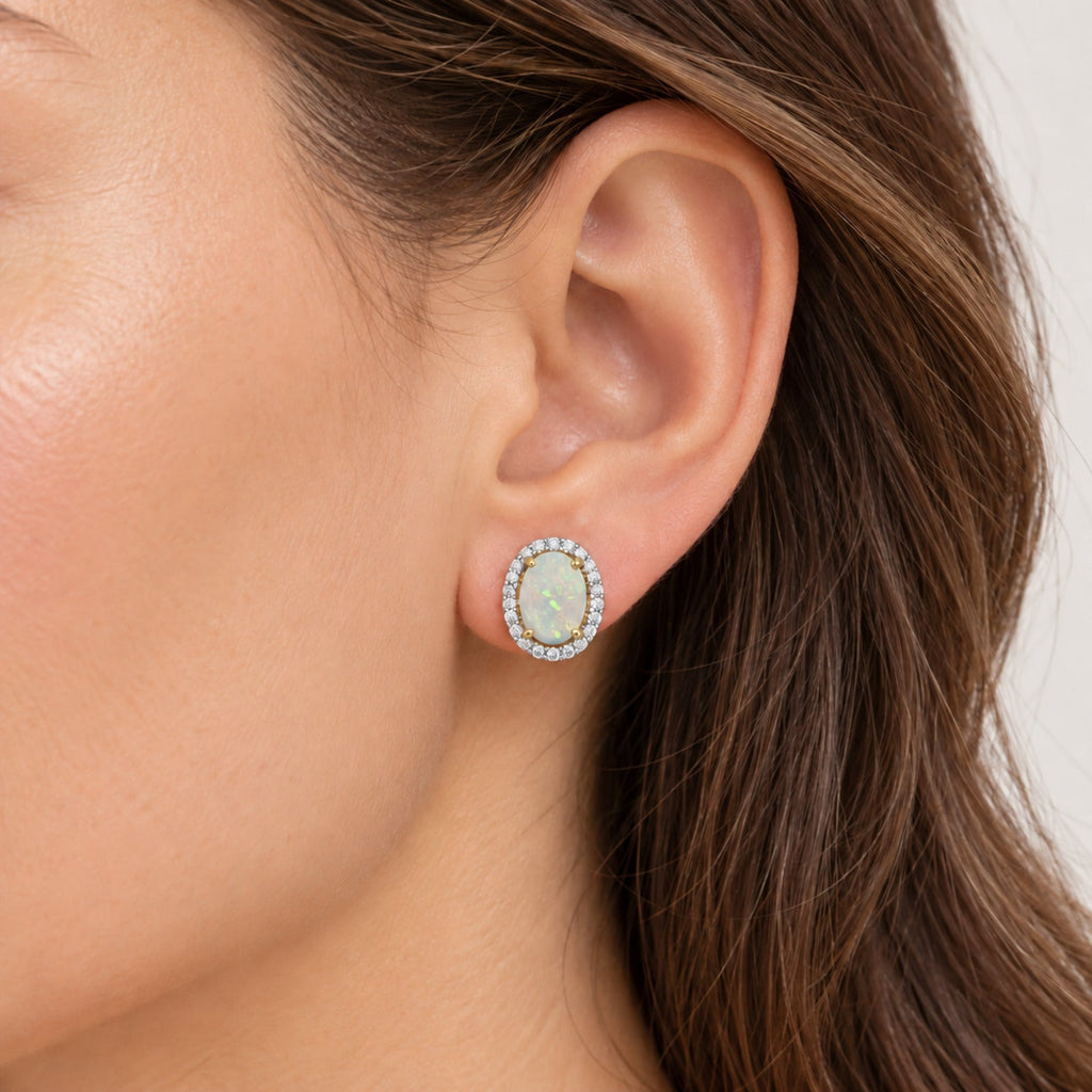 Oval Lab Opal & Lab Diamond Halo Stud Earrings 14K Yellow Gold 1.12ct, close-up model view