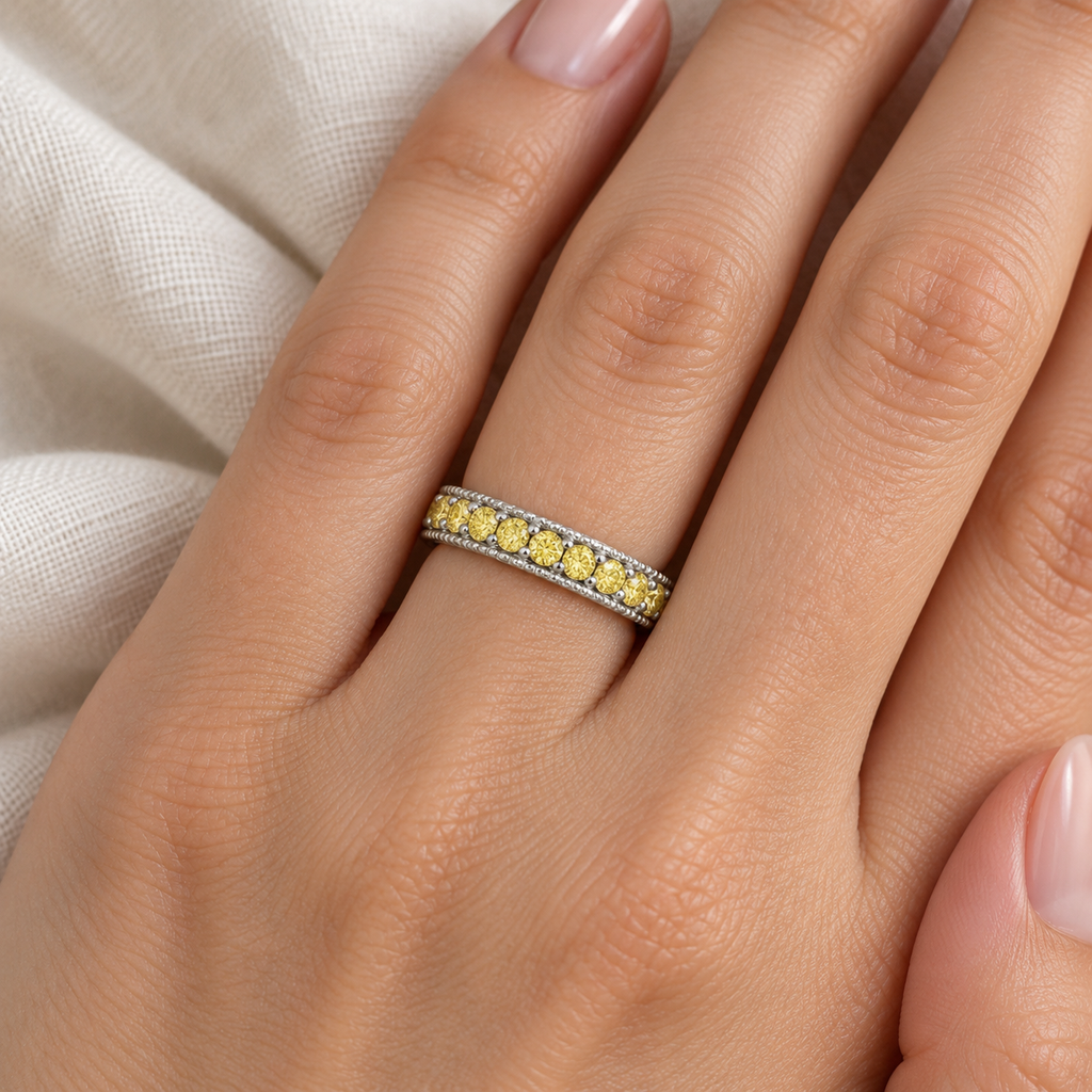 Fancy Yellow Canary Diamond Eternity Ring Band 14K White Gold (1.00 ct) — 4 mm band close-up on ivory linen