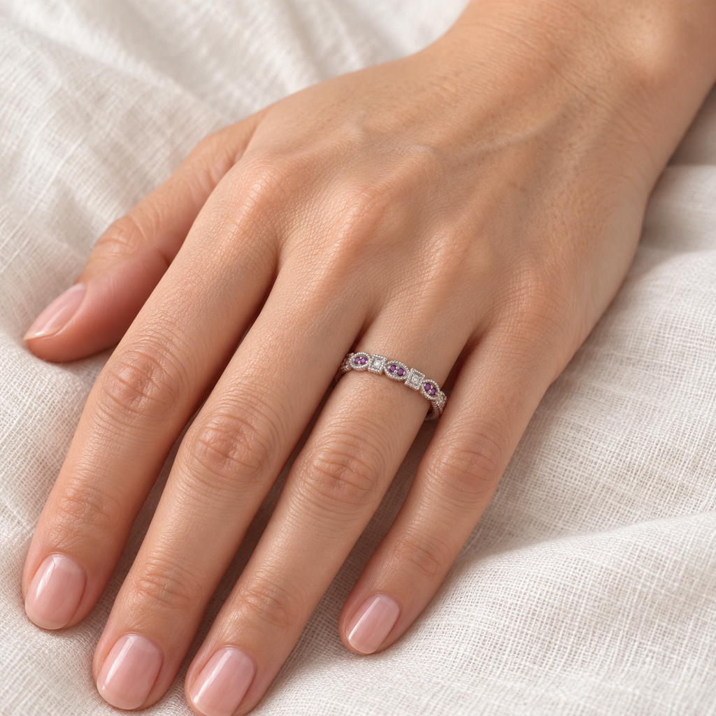 Natural amethyst and diamond vintage stackable ring in 14k white gold, 3.2mm, 0.15ct — at the base of the left ring finger on ivory linen