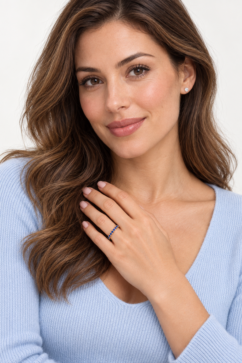 Blue Sapphire Eternity Band Anniversary Ring 14K Yellow Gold (0.50ct) — face-visible studio portrait, ring on left ring finger