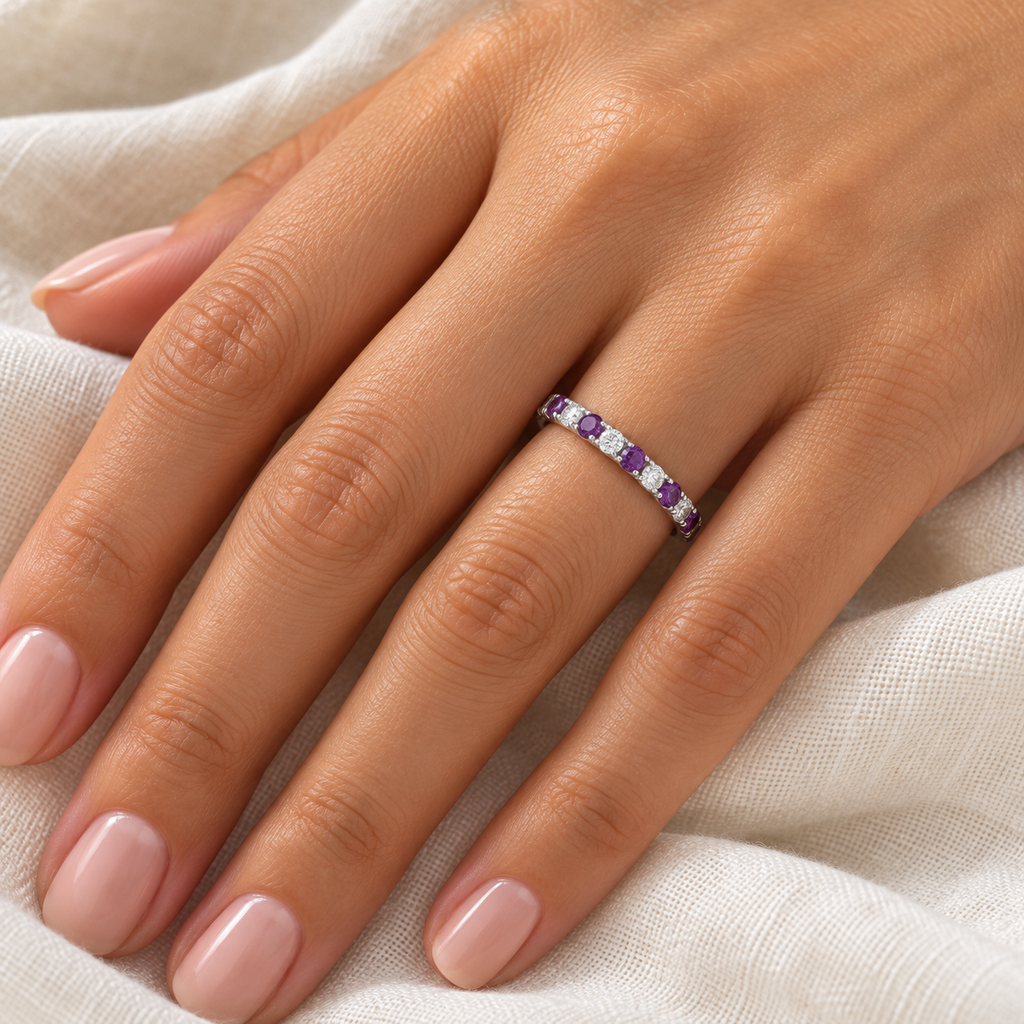 Amethyst and diamond 14K white gold 2 mm eternity band on left hand, ivory linen closeup