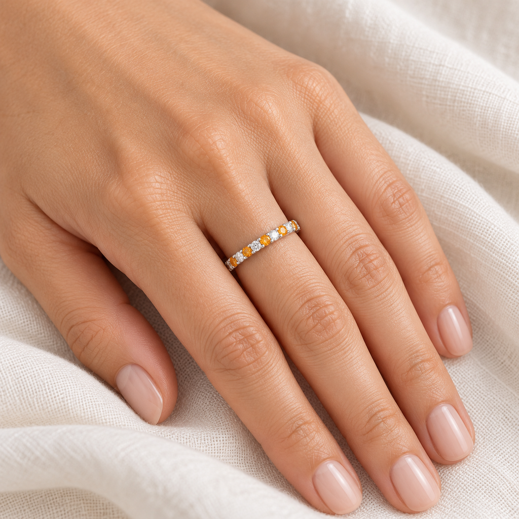 Citrine and diamond 14K white gold 2 mm eternity band on left hand, ivory linen closeup