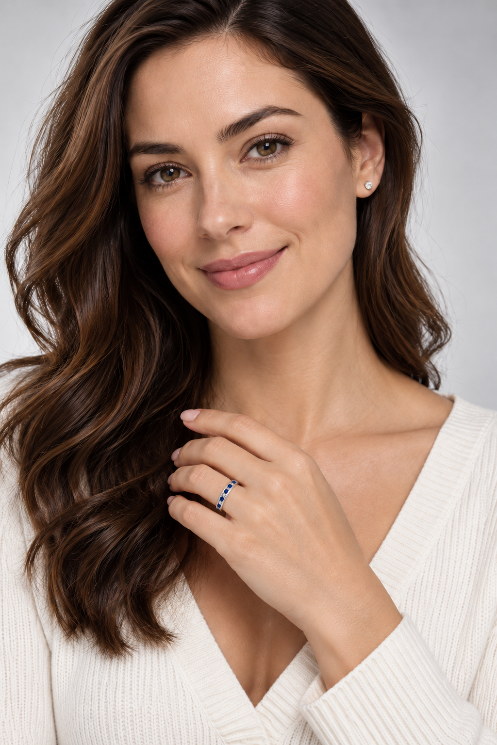Alternating natural blue sapphire and diamond channel-set ring in 14K white gold, professional studio portrait