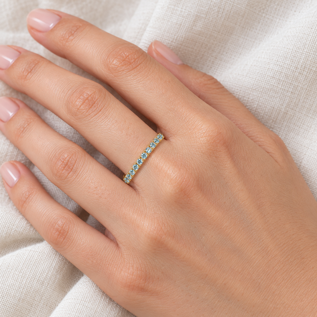 Aquamarine Eternity Stackable Ring Guard Band 14K Yellow Gold (0.50ct) — ivory linen close-up on left hand