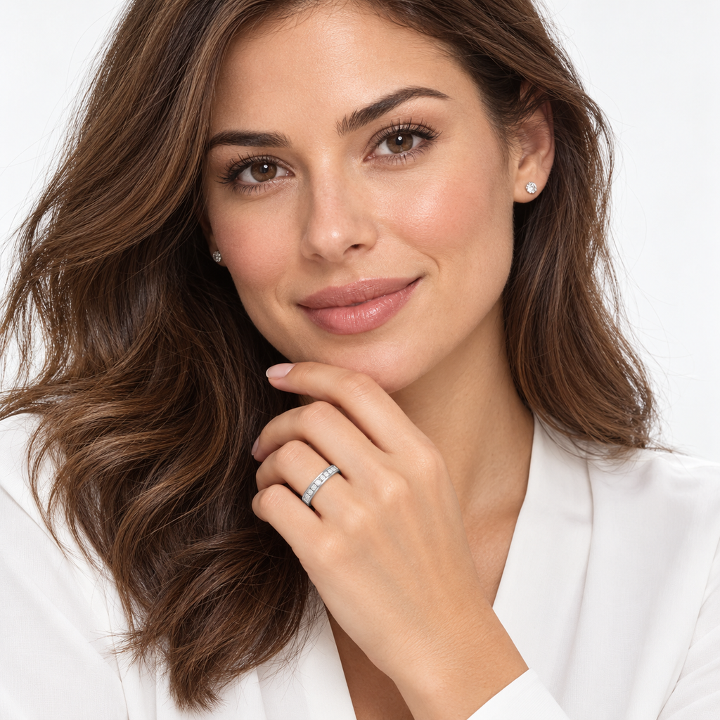 Nine princess-cut lab-grown diamonds in a 14K white gold channel-set band, 4mm, 0.50ctw — face-visible studio portrait, left ring finger