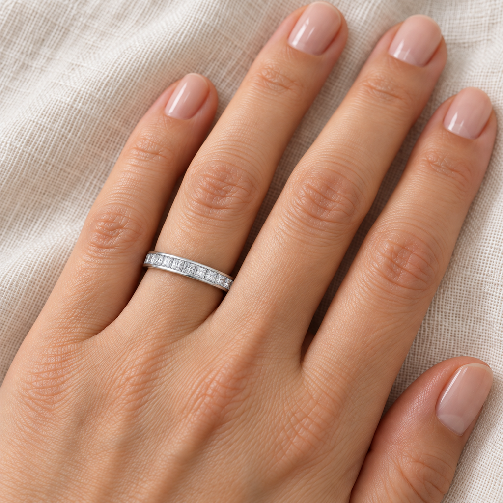Princess-Cut Diamond Eternity Ring Band 14k White Gold (1.16ct) — 3 mm band on left ring finger, ivory linen close-up
