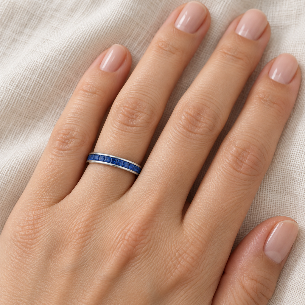 Lab-grown blue sapphire 3 mm princess-cut eternity band in 14k white gold — ivory-linen close-up