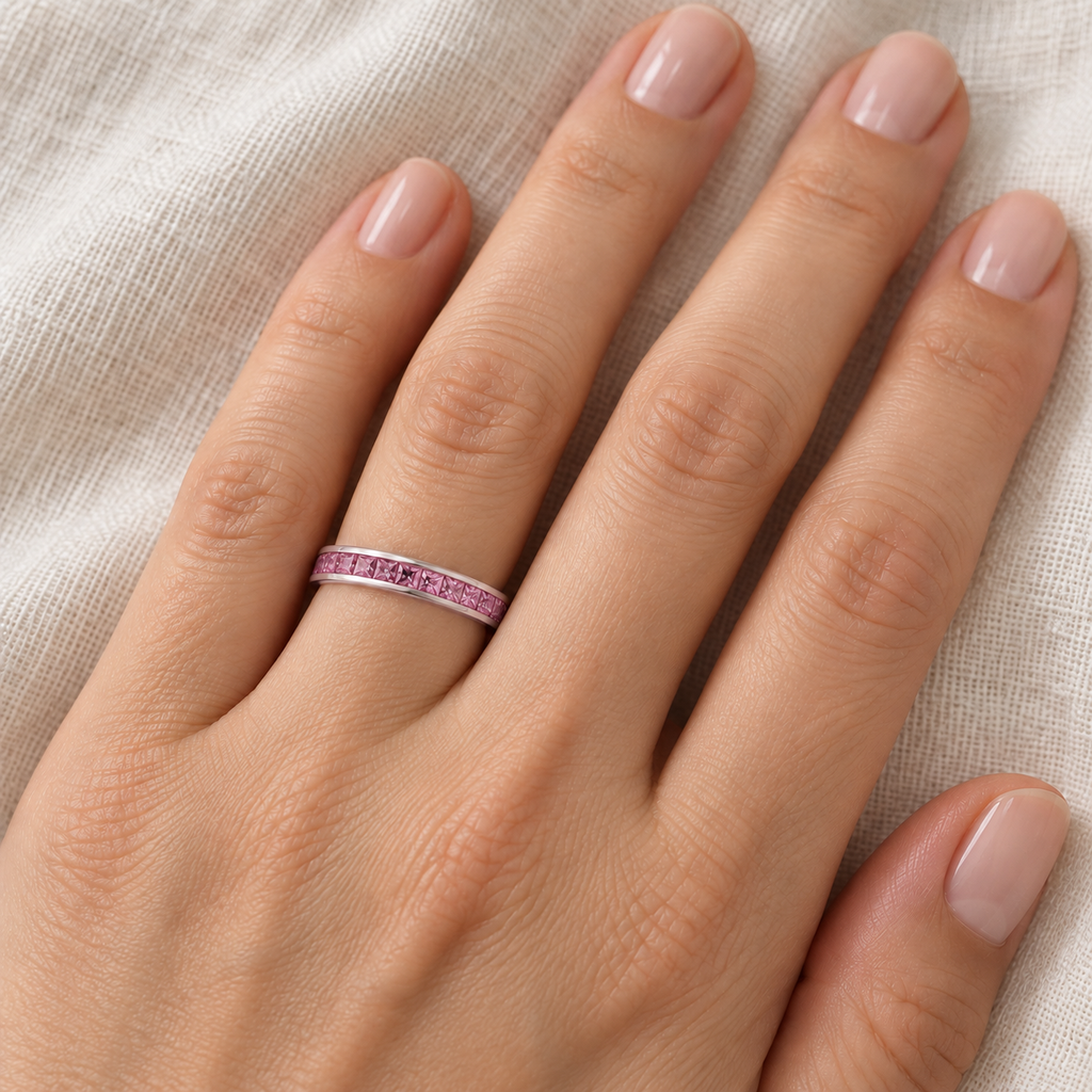 Princess-Cut Pink Sapphire Eternity Ring Band 14k White Gold (1.36ct) — 3 mm band on left ring finger, ivory linen close-up