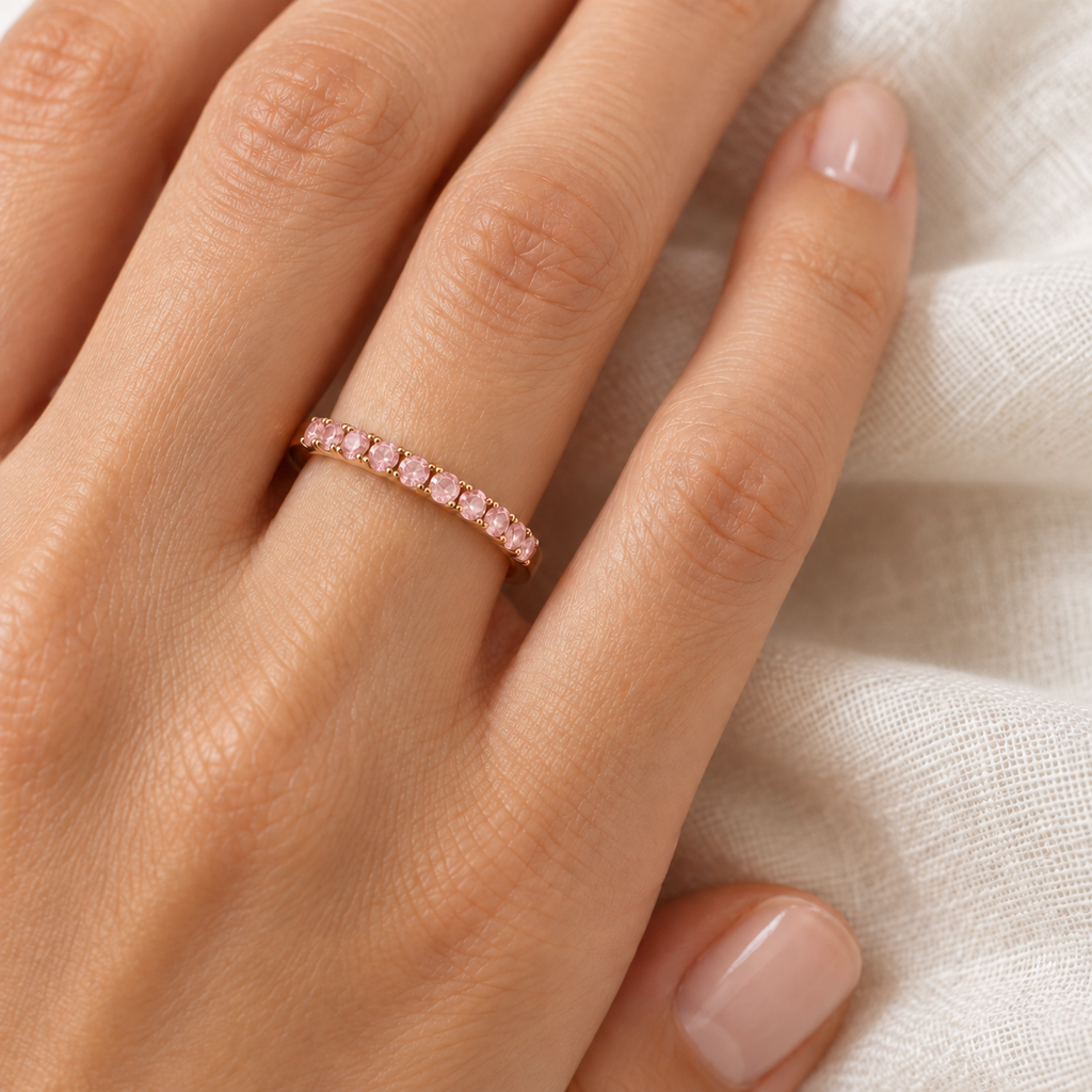 Natural pink sapphire 2 mm stackable band in 14k rose gold — ivory-linen close-up