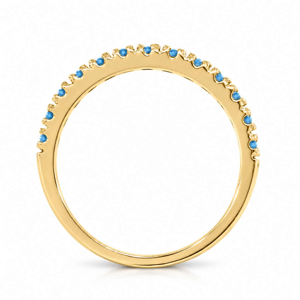 Blue topaz stackable band in 14k yellow gold — concealed-stone edge-on side profile