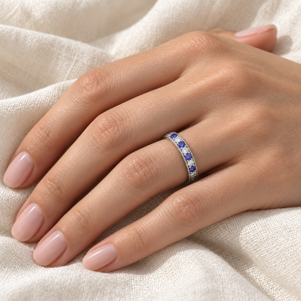 Tanzanite and diamond anniversary band in 14K white gold, 0.30ct, ivory linen hand close-up