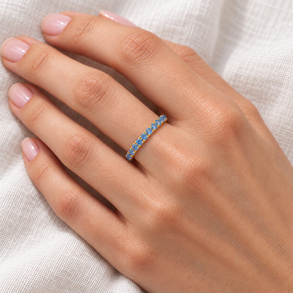 Blue Topaz Eternity Stackable Ring Band 14K Yellow Gold (0.75ct) — ivory linen close-up on left hand