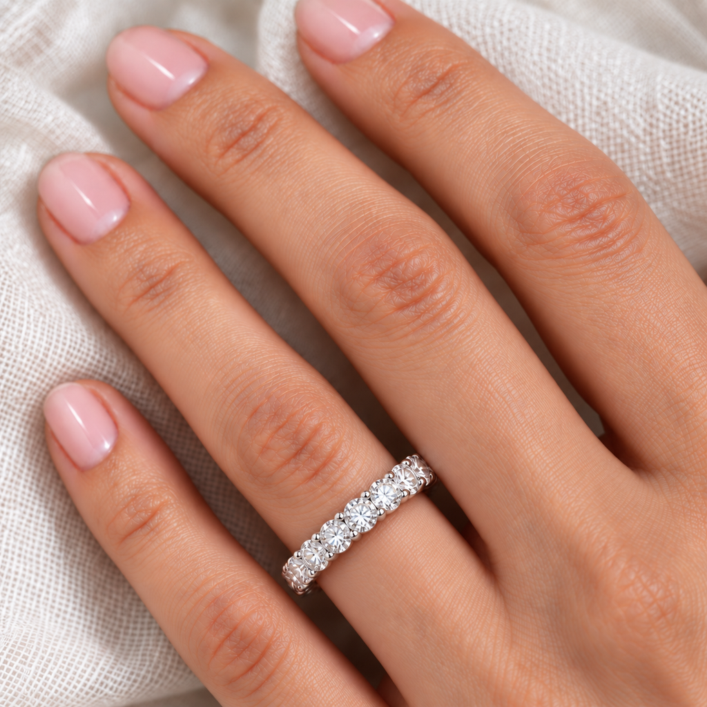 Diamond eternity ring wedding band in 14k white gold, 4.00 carats, close-up on ivory linen