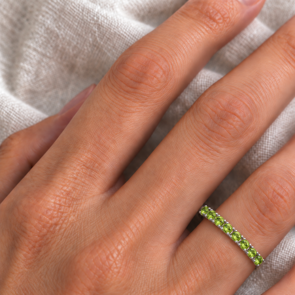 IR244 natural peridot 14k white gold 2 mm band — ivory linen close-up