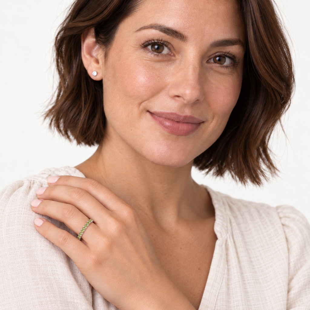 IR244 natural peridot 14k white gold 2 mm band — studio portrait