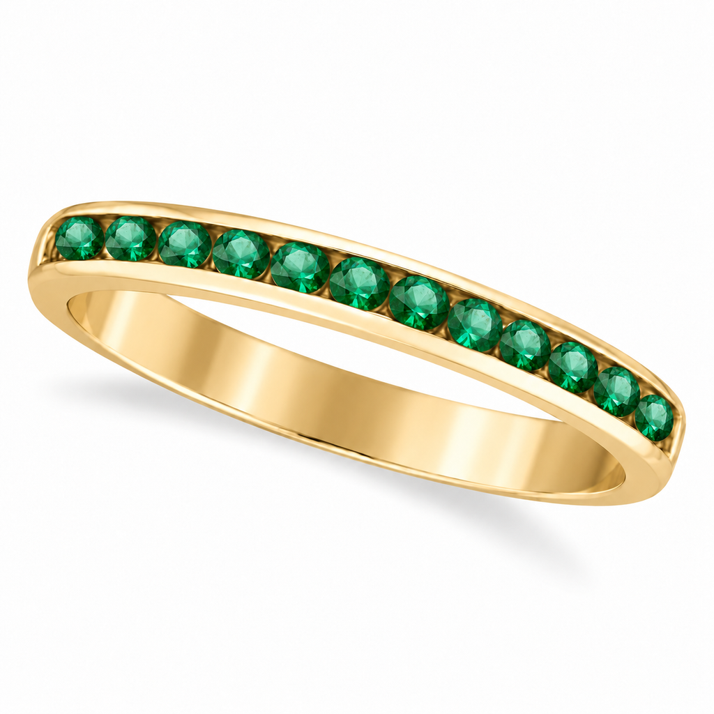 Channel-set natural emerald band in 14k yellow gold, main product view on white