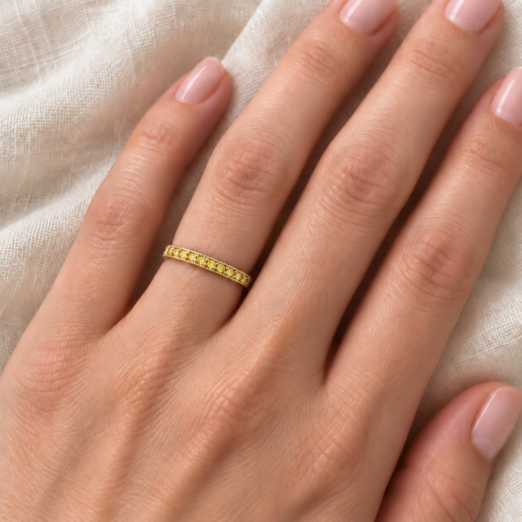 Fancy Yellow Canary Diamond Stackable Ring Band 14K Yellow Gold — 2 mm band close-up on ivory linen