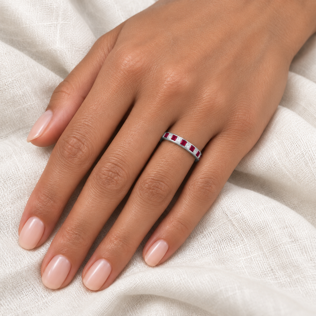 14k white gold, 4mm, five lab rubies alternating four lab-grown diamonds, 0.79ctw on left ring finger at base, ivory linen closeup