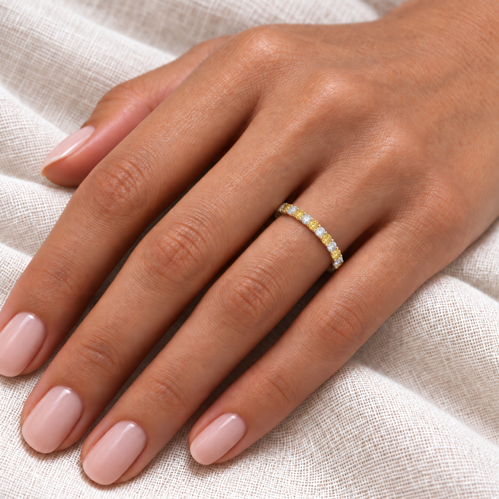 IR538LG lab fancy yellow and lab white diamond 2.5mm eternity band on left hand over ivory linen, realistic fine scale