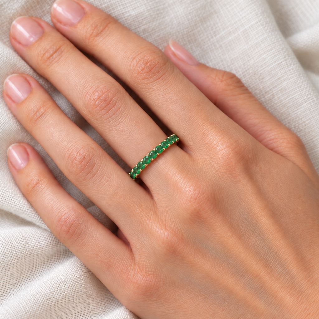 Emerald Eternity Stackable Ring Band 14K Yellow Gold (0.75ct) — ivory linen close-up on left hand