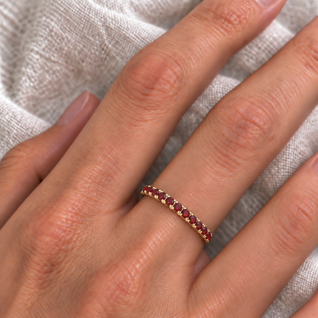 IR688 natural garnet 14k yellow gold 2 mm band — ivory linen close-up