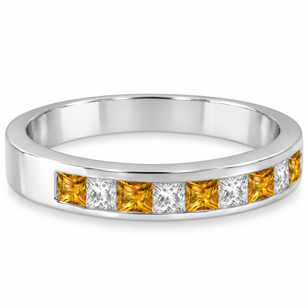 Princess-cut citrine and diamond channel ring in 14K white gold on left ring finger over ivory linen
